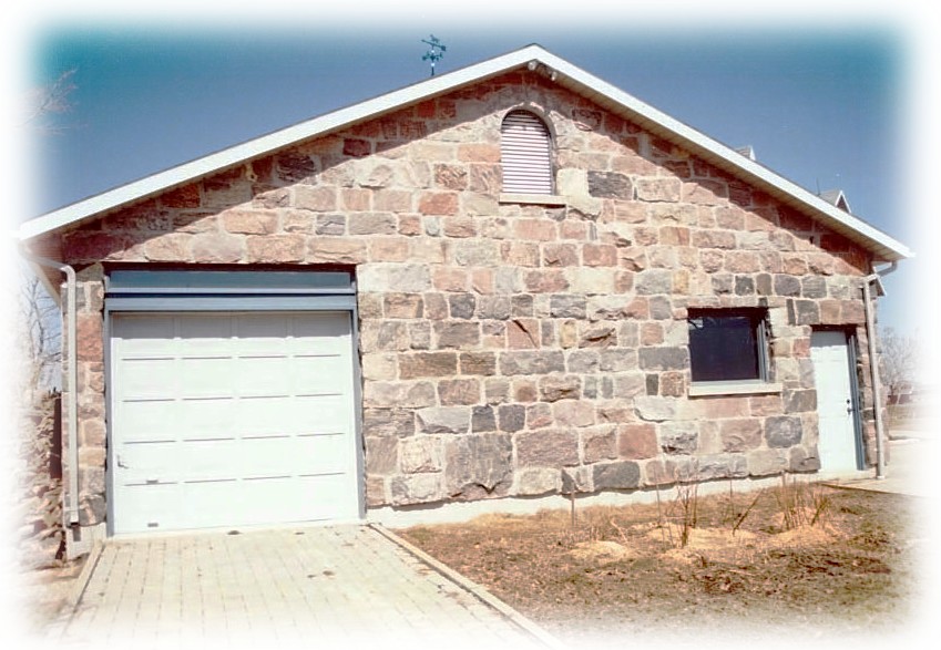 split fieldstone squared garage front